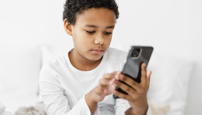 young-boy-kid-using-mobile.jpg
